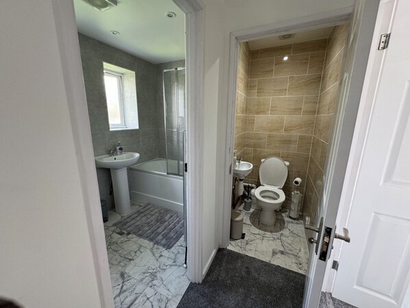 Shower, hair dryer, towels, soap