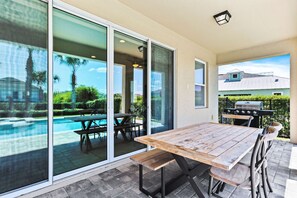 Outdoor dining - 4BR Stylish Villa • Pool, Movie Room • Near Disney (Kissimmee)