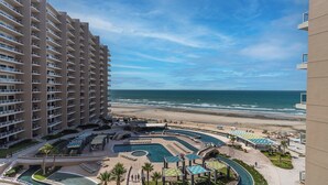 A hotel with multiple floors, a pool area with various pool sections, and a beach view. - Las Palomas Phase II Cortez 507 Exceptional Oceanview 3BR 3BA Unit (Puerto Peñasco)