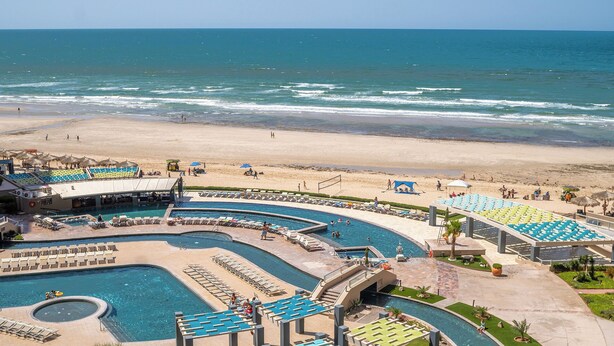 A resort with multiple swimming pools, a beach, and a view of the ocean. - Las Palomas Opalo 502 Exceptional Oceanview 1BR 1BA Unit (Puerto Peñasco)