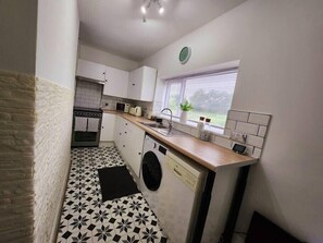 Fridge, microwave, oven, stovetop - The Trackside Cottage (Carlin How)
