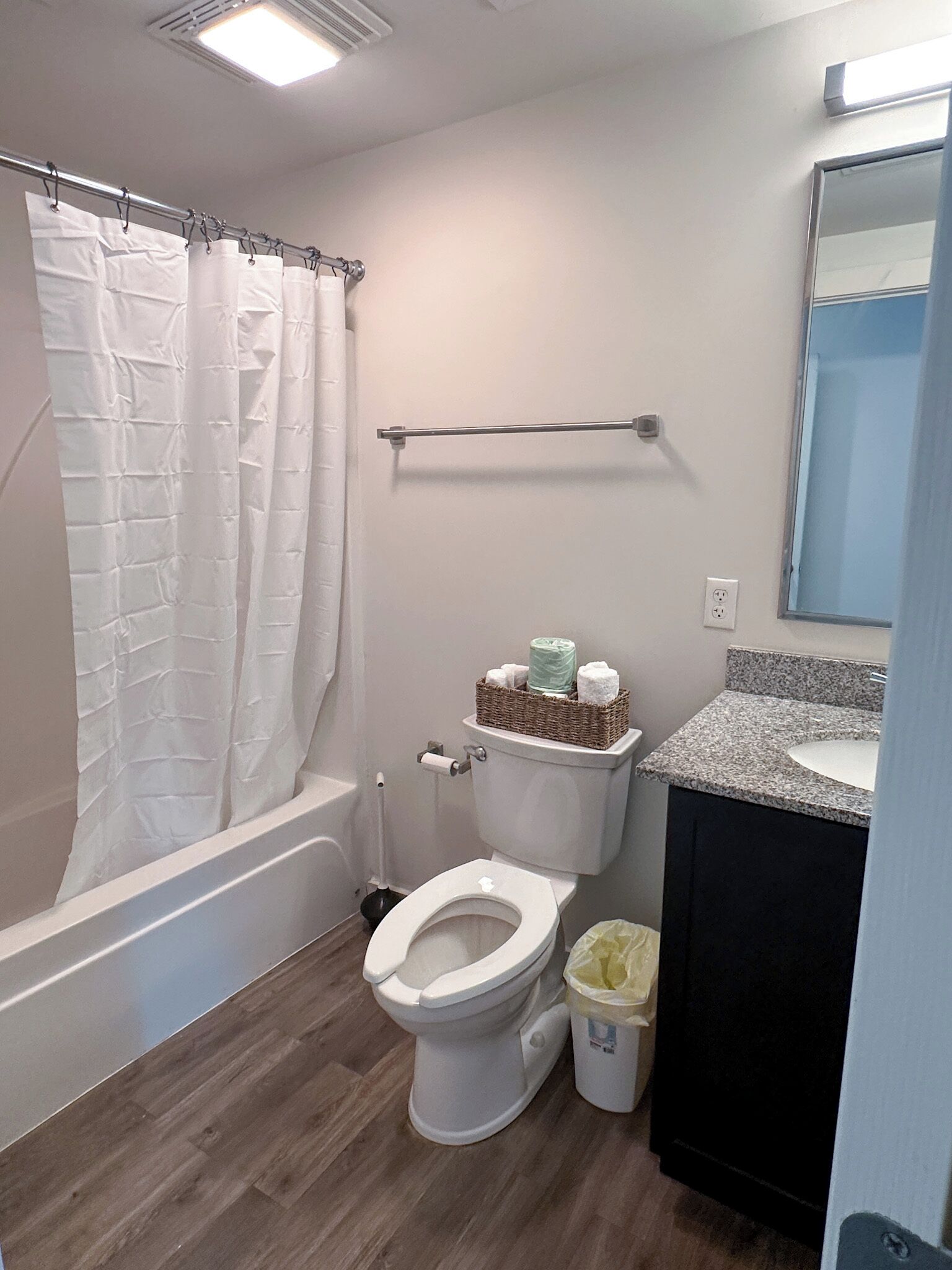 A modern bathroom with a toilet, bidet, and a sink.