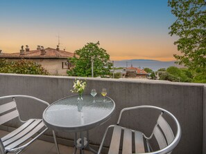 Enjoy a romantic dinner on the terrace with a stunning coastal view.