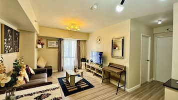 Family Condo, 2 Bedrooms, Pool Access, Partial Sea View | Living area | 55-inch Smart TV with cable channels, Netflix, streaming services