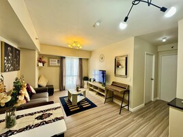 Family Condo, 2 Bedrooms, Pool Access, Partial Sea View | Living area | 55-inch Smart TV with cable channels, Netflix, streaming services