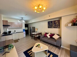 Family Condo, 2 Bedrooms, Pool Access, Partial Sea View | Living area | 55-inch Smart TV with cable channels, Netflix, streaming services