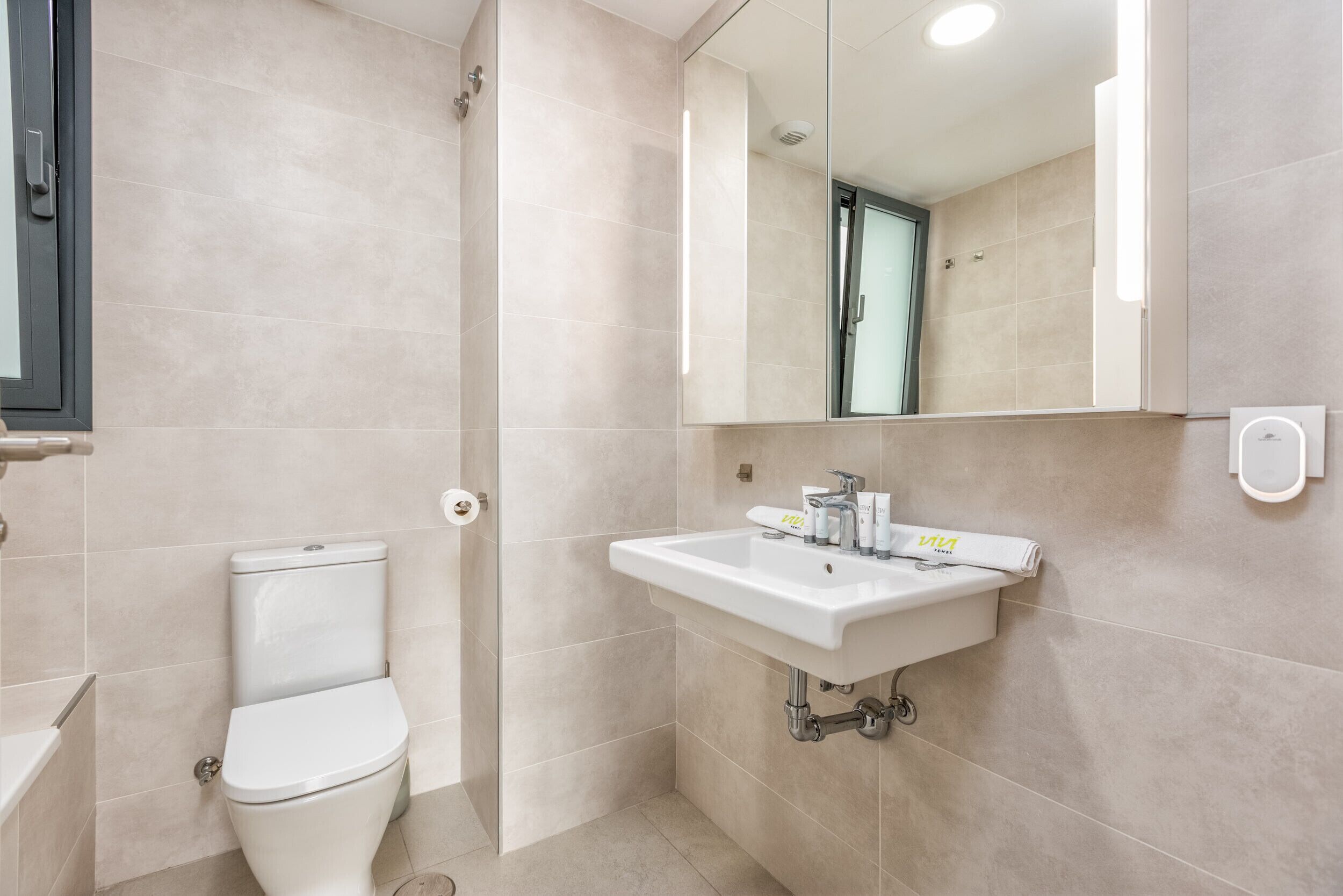 Shower, hair dryer, towels, shampoo