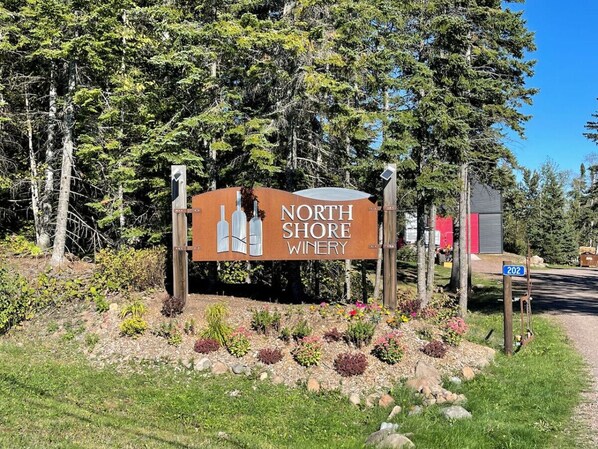A sign for North Shore Winery with a clear view of the surrounding landscape. - 3-bed Family Friendly | Ski-In/Out| Pool & Hot Tub (Lutsen)