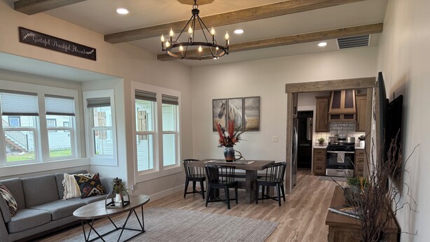 A spacious living room with a dining area, a kitchen, and a view of the outside. - House in the heart of Darby, Montana
Fully remodeled. (Darby)