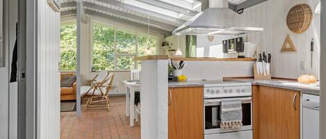 Fridge, stovetop, dishwasher, coffee/tea maker