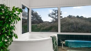 A spa area with a hot tub, a small pool, and a view of the surrounding landscape. - "Annlisa" - 1km from the sea by Interhome (Blokhus)