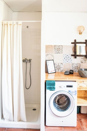 Shower, hair dryer, towels, soap
