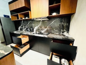 Fridge, stovetop, cookware/dishes/utensils, dining tables