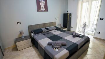 1 bedroom, desk, iron/ironing board, travel crib