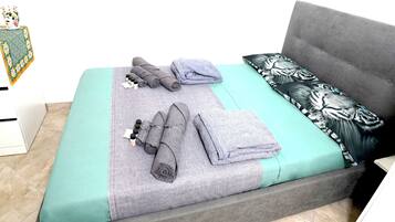 1 bedroom, desk, iron/ironing board, travel crib