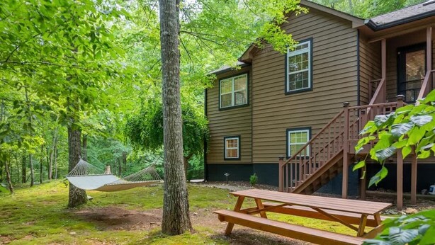 A cabin with a deck, a hammock, and a fire pit. - Cozy Nest Cabin at Coosawattee (Ellijay)