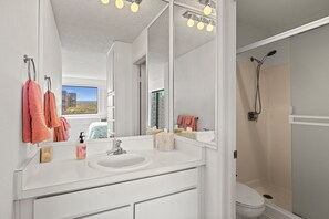 Shower, hair dryer, towels