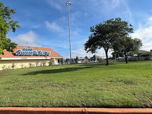 A building with a sign reading "Reno Swim & Slide." - Cozy Home Wt Hot Tub, WiFi n Smart Tv (Midwest City)