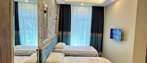 Egyptian cotton sheets, premium bedding, down duvets, minibar