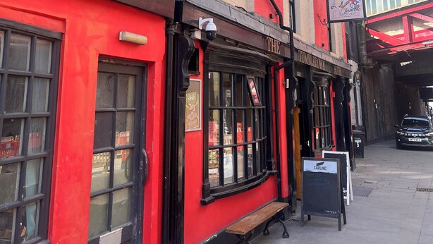 A red building with a sign for 'The Union Bar' and 'Tumbledown House'. - Tumbledown Hotel (Shrewsbury)