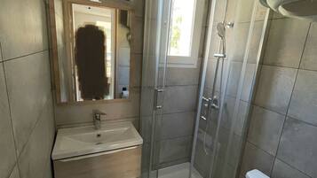 Shower, hair dryer, towels, toilet paper