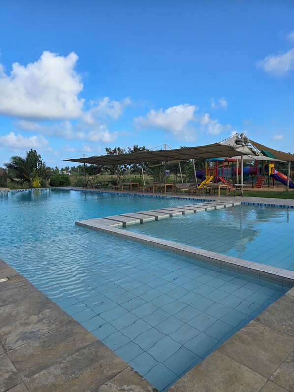 Relax by the serene pool surrounded by a spacious deck.