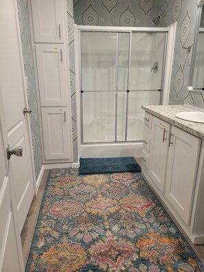 Shower, hair dryer, towels, soap