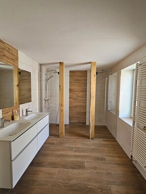 Shower, hair dryer, towels, toilet paper