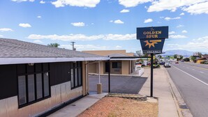 A building with a sign reading "The Golden Spur" and a vacant sign above it. - The Golden Spurs (Panguitch)