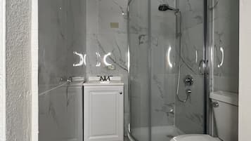 Shower, hair dryer, towels, soap