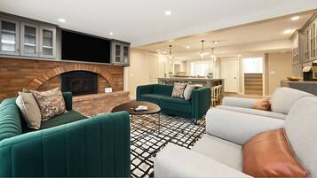 Smart TV, fireplace, foosball, books