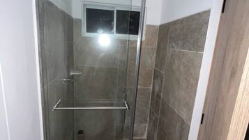 Shower, towels, soap, toilet paper