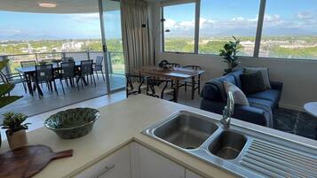 Superior Apartment, City View | Living area | Flat-screen TV