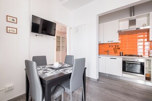 Apartment, Balcony | Living area | 35-inch TV with digital channels