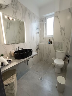 Shower, hair dryer, towels, soap