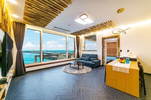 30py Ocean Pool Spa | Living area | 65-inch flat-screen TV with cable channels