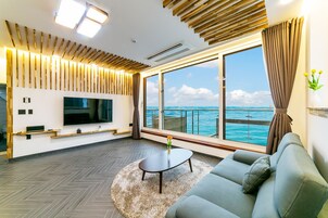 30py Ocean Pool Spa | Living area | 65-inch flat-screen TV with cable channels