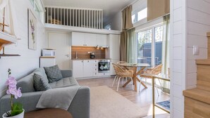 A modern interior with a kitchen, dining area, and living space.