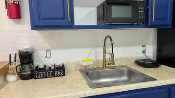 Fridge, microwave, stovetop, coffee/tea maker