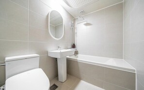 Shower, hair dryer, slippers, towels