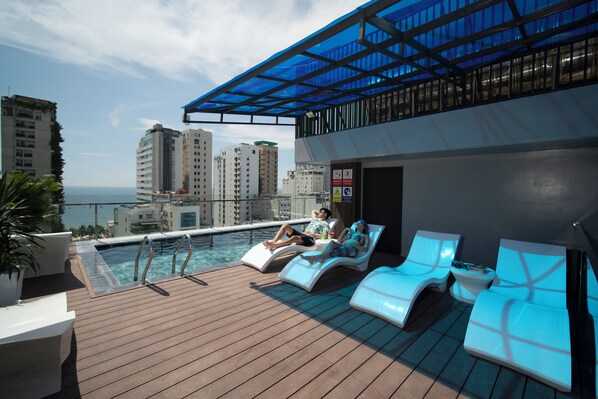 Outdoor pool, open 6:00 AM to 6:30 PM, pool umbrellas, sun loungers