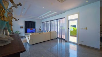 Executive Villa, Pool View | Living area | Flat-screen TV