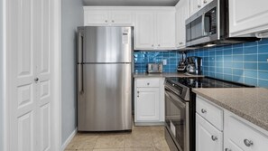 Condo, Multiple Beds, Balcony, Ocean View (Tranquillity 220) | Private kitchen | Fridge, microwave, oven, stovetop
