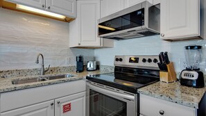 Condo, Multiple Beds, Balcony, Ocean View (Palms A12) | Private kitchen | Fridge, microwave, oven, stovetop