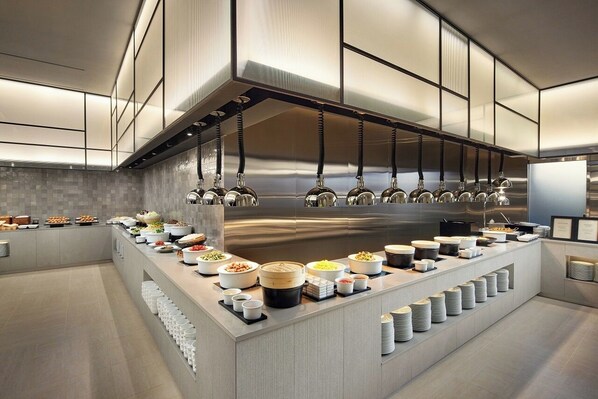 A modern kitchen with a buffet setup, stainless steel appliances, and a clean, organized layout. - Shilla Stay Jeonju Hanok Village (Jeonju)