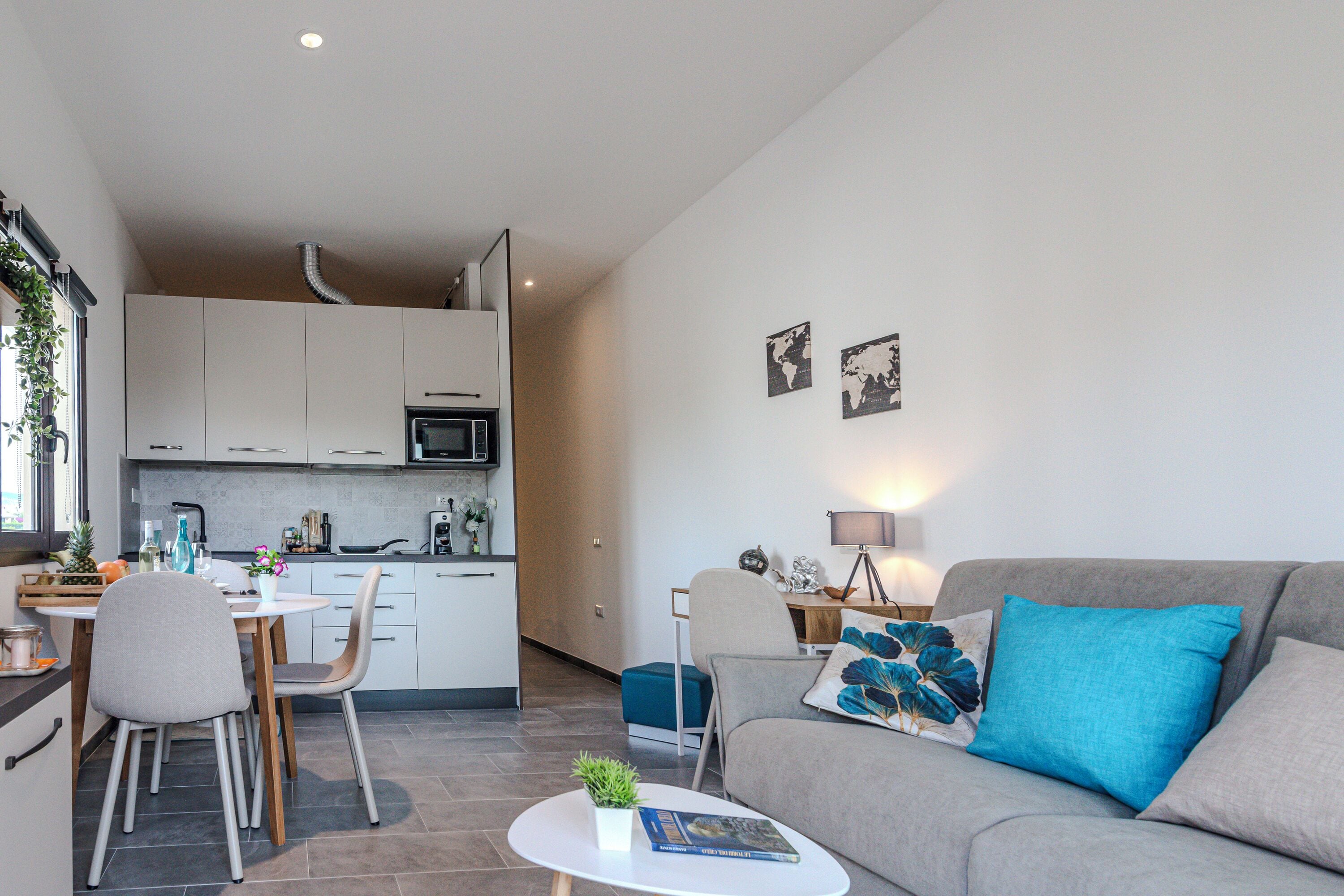 Family Studio (Always Traveling Near The City Center) | Living area | 21-inch flat-screen TV with cable channels, TV