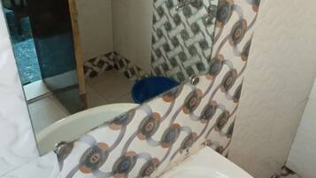 Shower, rainfall showerhead, towels, soap