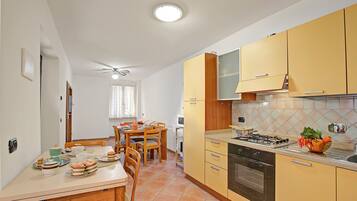 Family Apartment, 2 Bedrooms (Queen Elena Home Centro Sanremo) | Private kitchen | Fridge, microwave, oven, stovetop