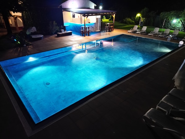 Seasonal outdoor pool, open 9:00 AM to 8:00 PM, pool loungers