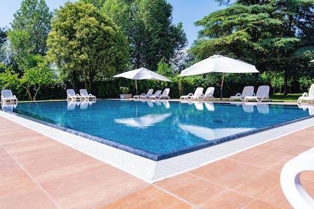 Seasonal outdoor pool, open 9:00 AM to 8:00 PM, sun loungers